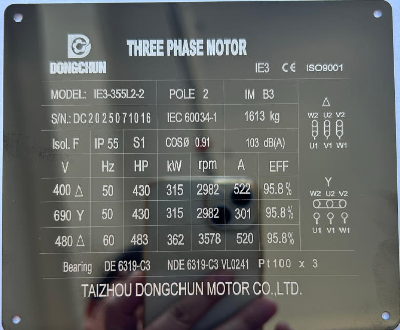 Close-up of an IE3 motor's nameplate showing efficiency ratings